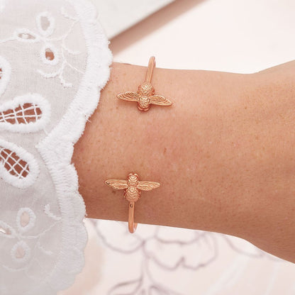 Rose gold colored “bee bracelet”.